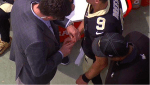 trainers was working in that area between Brees's thumbs and index finger.
