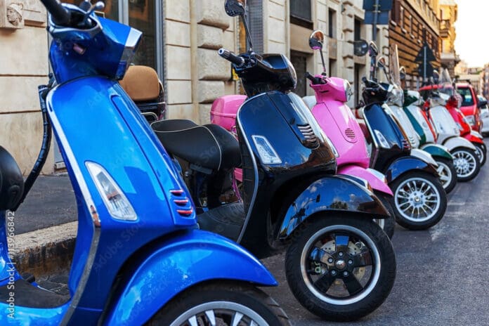multi-colored scooters vespa